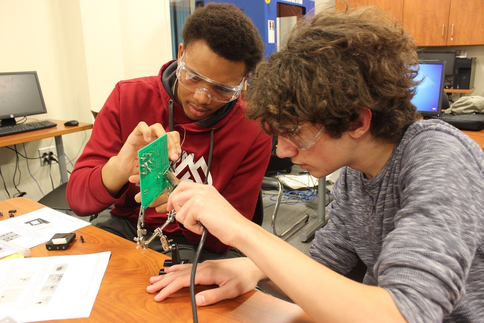 students working with electronics